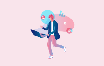 man holding a laptop and walking