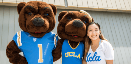 two bears with smiling woman