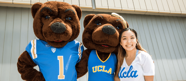 two bears with smiling woman