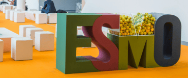 ESMO logo made partially from apples